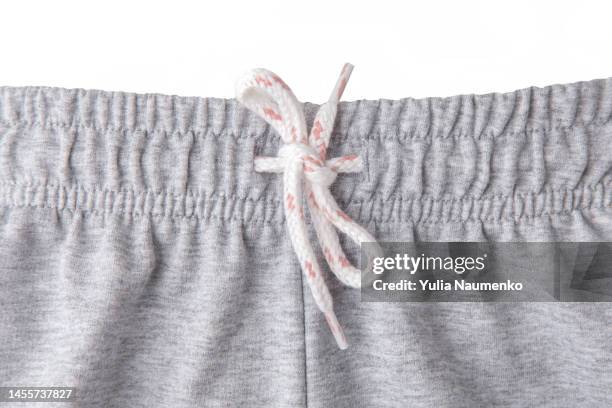elastic waistband and adjusting drawstring. the top of sweatpants or pajamas. - waistband stock pictures, royalty-free photos & images
