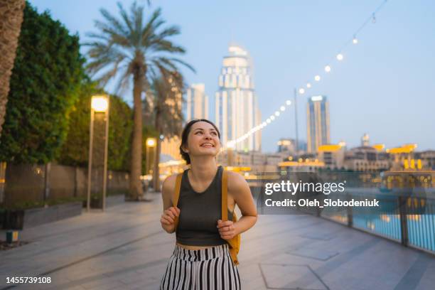 woman exploring dubai - burj khalifa dubai stock pictures, royalty-free photos & images
