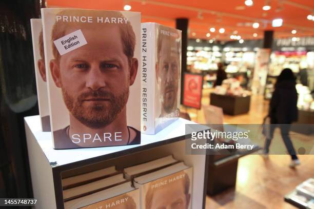 Copies of Prince Harry’s memoir “Spare” sit on display at the Dussmann das KulturKaufhaus bookshop, on January 11, 2023 in Berlin, Germany. According...