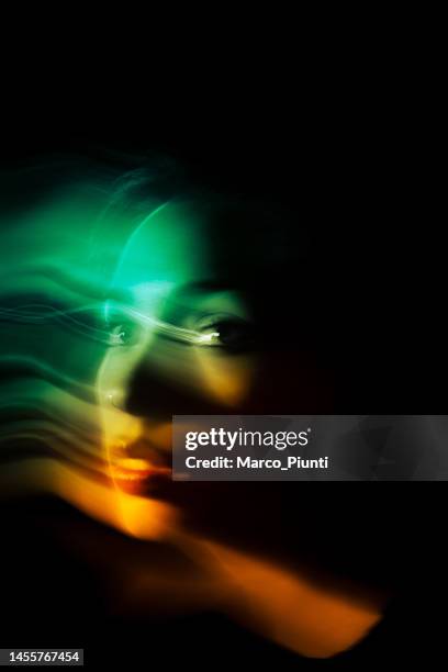 portrait of woman long exposure - aura stock pictures, royalty-free photos & images