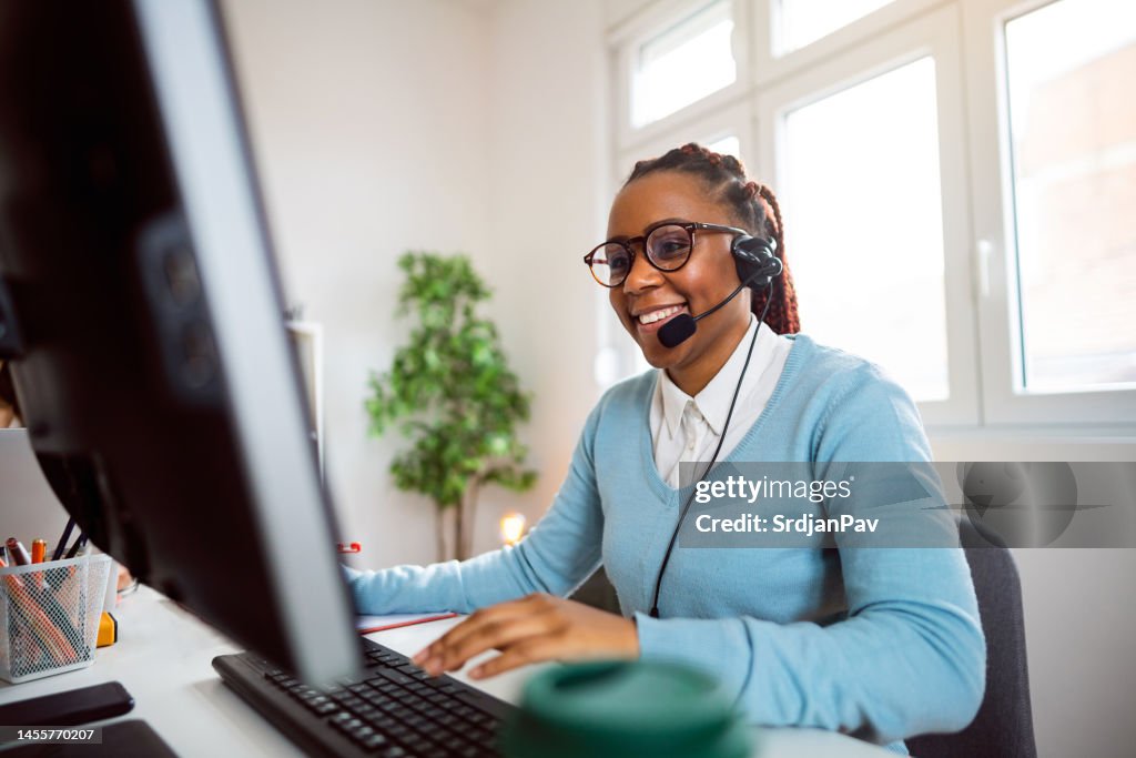 Customer support specialist working at her office