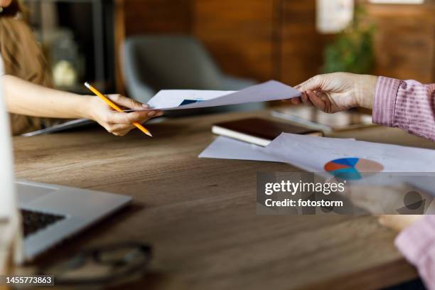 Exchanging Papers Photos and Premium High Res Pictures - Getty Images