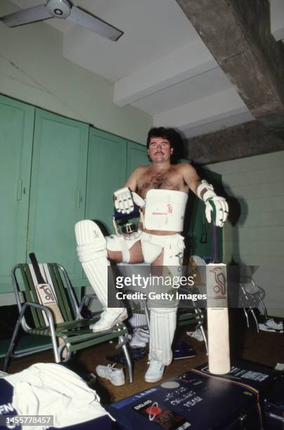 England batsman Allan Lamb pictured in his protective equipment that he used to face the West Indies fast bowling attack in the dressing room during...