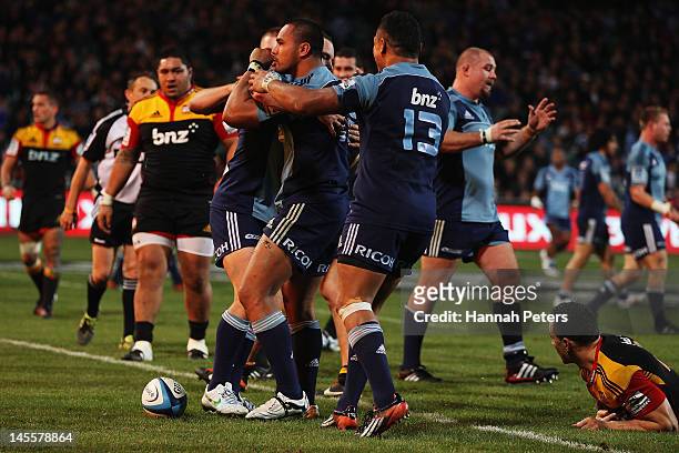 Rudi Wulf of the Blues celebrates after scoring a try during the round 15 Super Rugby match between the Blues and the Chiefs at North Harbour Stadium...