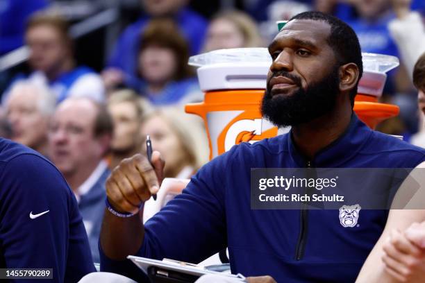 Director of Basketball Operations Greg Oden of the Butler Bulldogs watches a play during the second half of a game against the Seton Hall Pirates at...