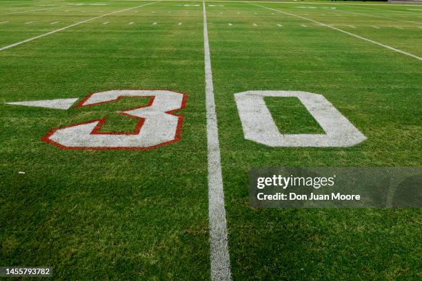 The 3 field marking is highlighted in support of Defensive Back Damar Hamlin of the Buffalo Bills on the field during the game between the...