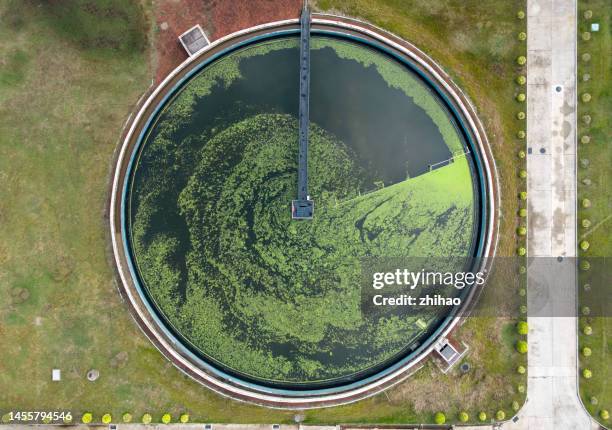 aerial view of the circular pool of the sewage treatment plant - aircraft point of view stock pictures, royalty-free photos & images