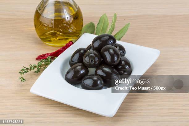 high angle view of olives with olives on table,arad,romania - oliva nera foto e immagini stock