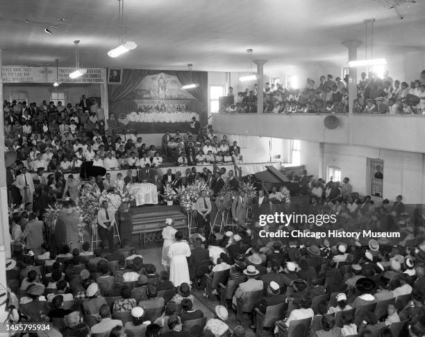 Elevated, interior view of mourners as they attend Emmett Till's funeral service at Roberts Temple Church of God in Christ , Chicago, Illinois,...