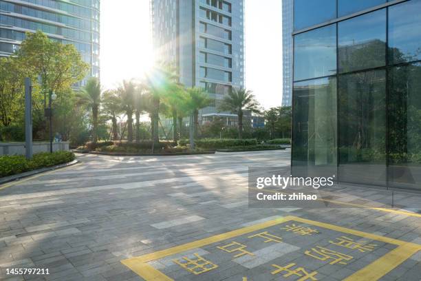 open space outside the office building in the financial district - paved back yard stock pictures, royalty-free photos & images