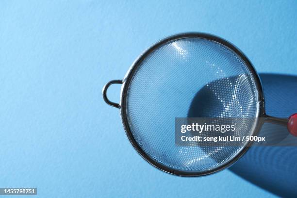 close-up of blue headphones against blue background,malaysia - sieve stock pictures, royalty-free photos & images