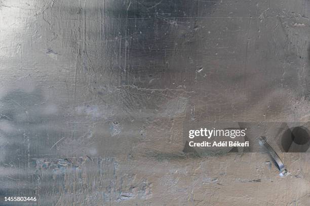 detail of silver colored metal door - modern iron gates stock pictures, royalty-free photos & images