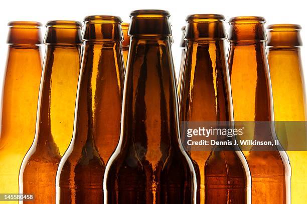 backlit beer bottles - brown bottle stock pictures, royalty-free photos & images