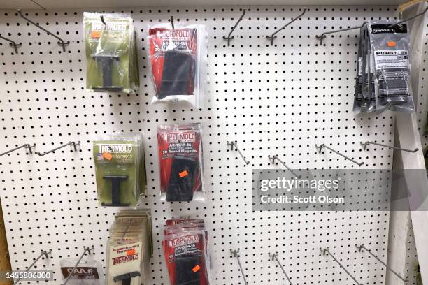 Racks sit nearly empty after high capacity rifle magazines were removed from display at Freddie Bear Sports on January 11, 2023 in Tinley Park,...