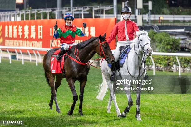 Jockey Silvestre De Sousa riding Money Catcher wins the Race 7 January Cup at Happy Valley Racecourse on January 11, 2023 in Hong Kong.