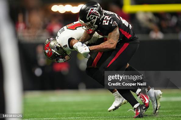 Cornell Armstrong of the Atlanta Falcons makes the tackle against the