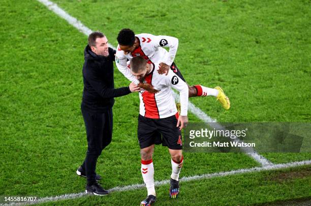 To R Southampton manager Nathan Jones, Kyle Walker-Peters and Lyanco both of Southampton during the Carabao Cup Quarter Final match between...