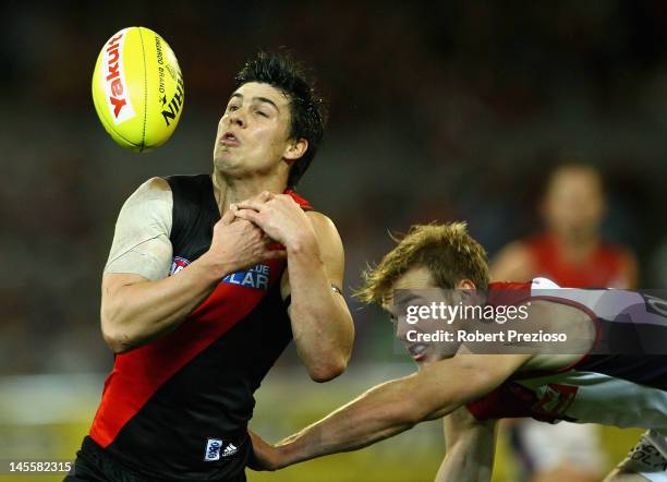 Angus Monfries of the Bombers flies for a mark during the round 10 AFL match between the Essendon Bombers and the Melbourne Demons at the Melbourne...