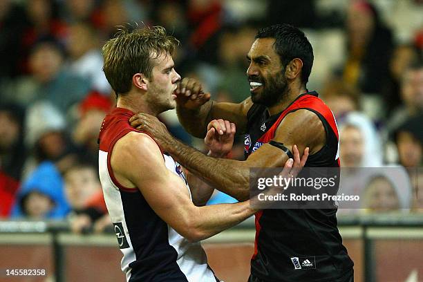 Nathan Lovett-Murray of the Bombers wrestles with Jack Watts of the Demons during the round 10 AFL match between the Essendon Bombers and the...