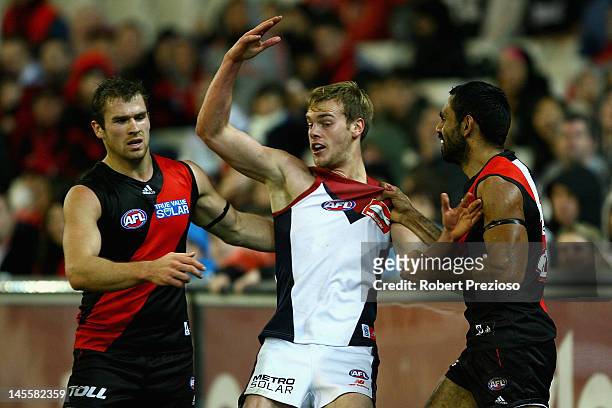 Nathan Lovett-Murray of the Bombers wrestles with Jack Watts of the Demons during the round 10 AFL match between the Essendon Bombers and the...