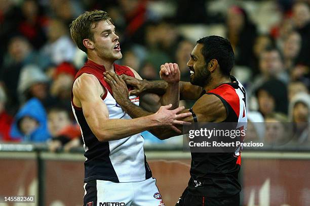 Nathan Lovett-Murray of the Bombers wrestles with Jack Watts of the Demons during the round 10 AFL match between the Essendon Bombers and the...