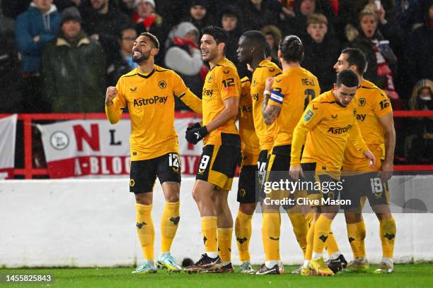 Raul Jimenez of Wolverhampton Wanderers celebrates with Matheus Cunha, Toti Gomes and teammates after scoring the team's first goal during the...