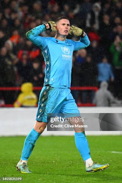 Dean Henderson of Nottingham Forest reacts after saving a penalty taken by Ruben Neves of Wolverhampton Wanderers in the penalty shoot out during the...