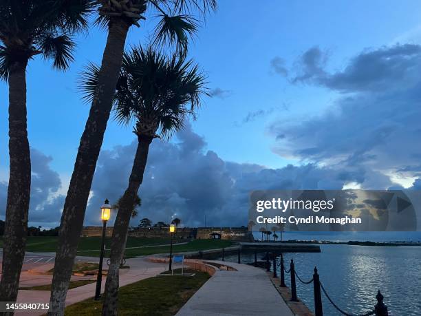 a walk along the water in st. augustine. matanzas river. - castillo de san marcos stock pictures, royalty-free photos & images