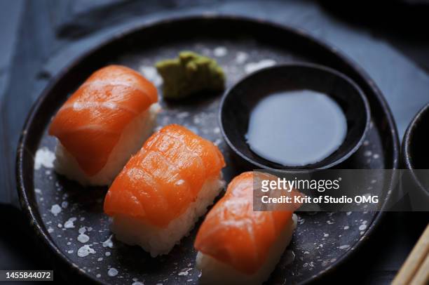 salmon sushi with wasabi and soy sauce - food studio shot stock pictures, royalty-free photos & images