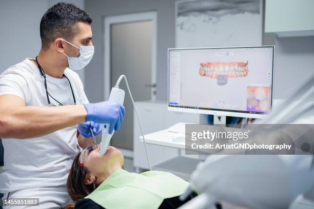 dental procedure with the help of 3d tooth scanner technology. - medical scanning equipment stock pictures, royalty-free photos & images