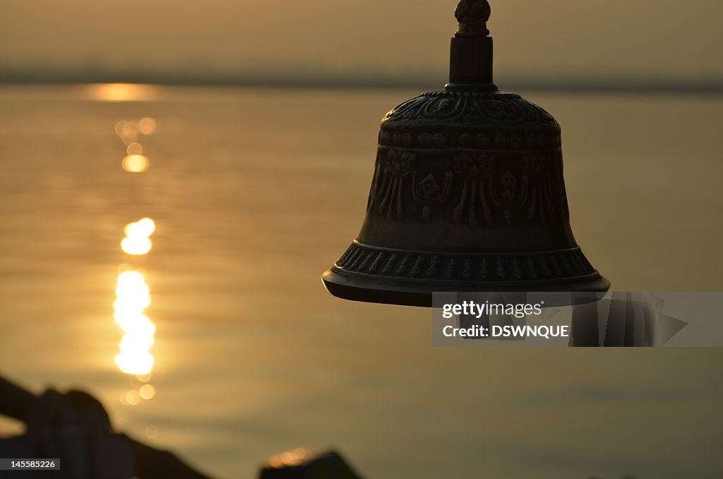 Sunrise against bell