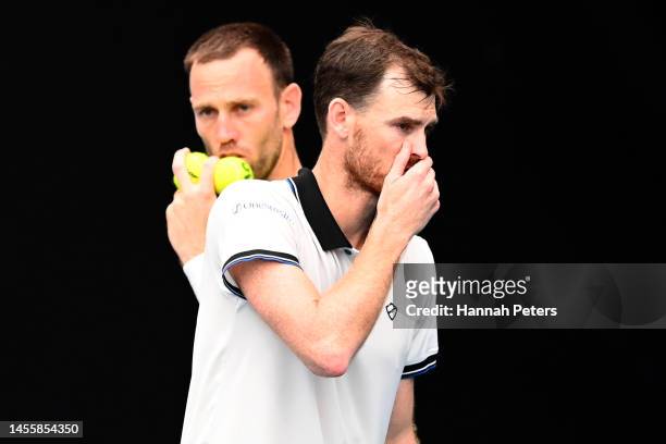 Michael Venus of New Zealand and Jamie Murray of Great Britain discuss their play during their doubles match with partner against Nathaniel Lammons...