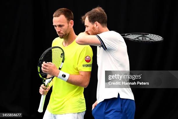 Michael Venus of New Zealand and Jamie Murray of Great Britain discuss their play during their doubles match with partner against Nathaniel Lammons...