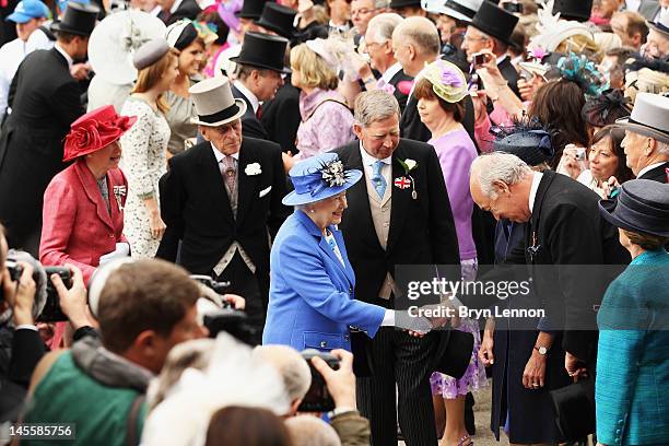 Queen Elizabeth II and Prince Philip, Duke of Edinburgh arrive for the Investec Derby, at the start of the weekend marking the Queen's Diamond...