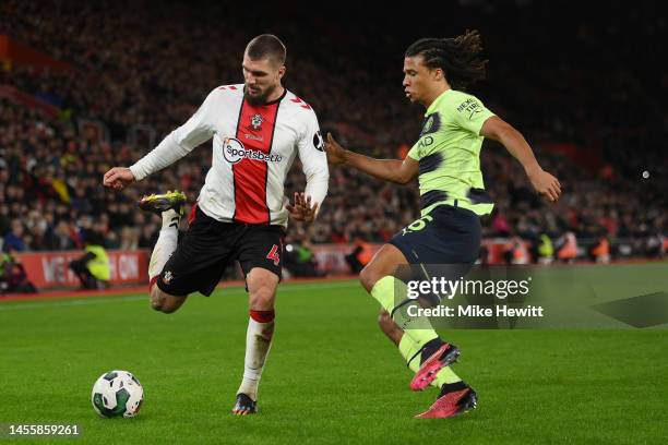 Lyanco of Southampton is challenged by Nathan Ake of Manchester City during the Carabao Cup Quarter Final match between Southampton v Manchester City...