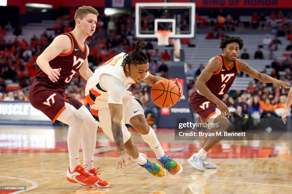 Virginia Tech Color Guard Sean Pedulla of the Virginia Tech Hokies guards Judah Mintz of the ...