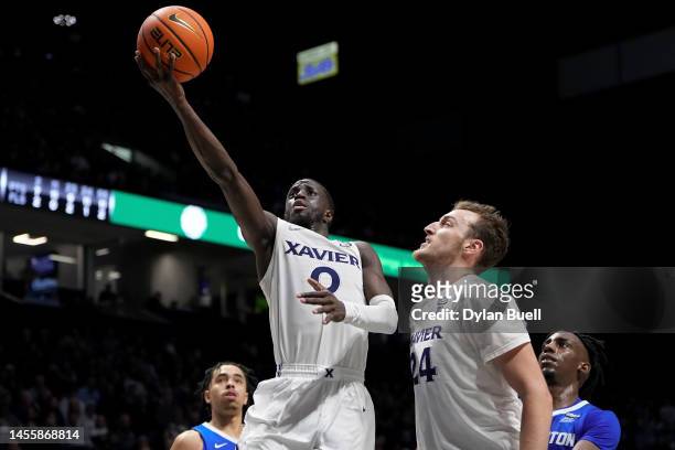 Souley Boum of the Xavier Musketeers puts up a shot ahead of teammate Jack Nunge in the second half against the Creighton Bluejays at the Cintas...
