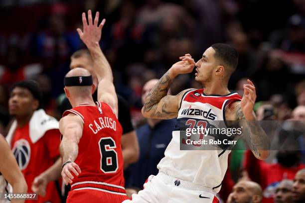 Kyle Kuzma of the Washington Wizards follows his game winning shot in front of Alex Caruso of the Chicago Bulls during the Wizards 100-97 win at...