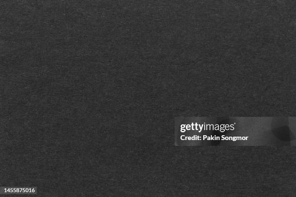 black paper sheet texture cardboard background. - couleur noire photos et images de collection
