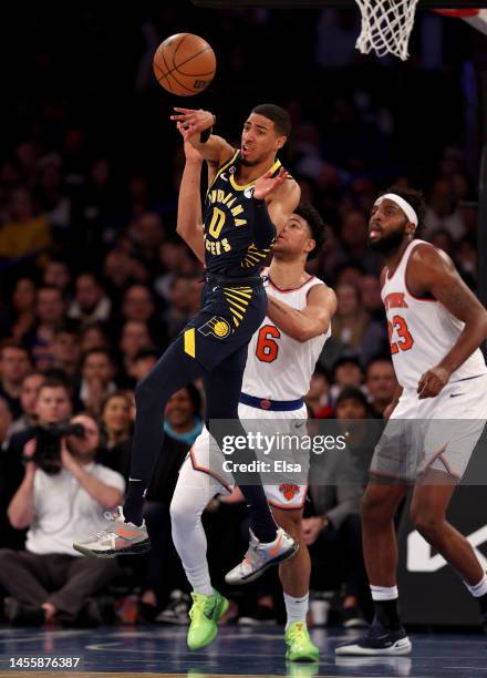 Tyrese Haliburton of the Indiana Pacers passes the ball as Quentin Grimes of the New York Knicks defends at Madison Square Garden on January 11, 2023...