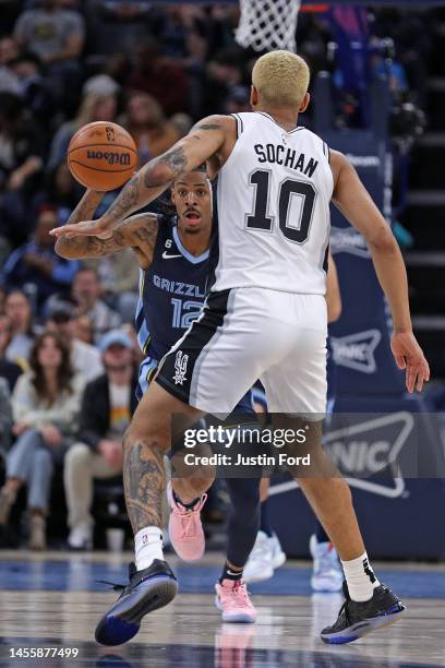 Ja Morant of the Memphis Grizzlies handles the ball during the second half against Jeremy Sochan of the San Antonio Spurs at FedExForum on January...