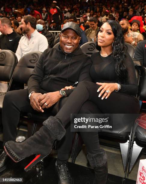 Simon Guobadia and Porsha Williams attend the game between the Milwaukee Bucks and the Atlanta Hawks at State Farm Arena on January 11, 2023 in...