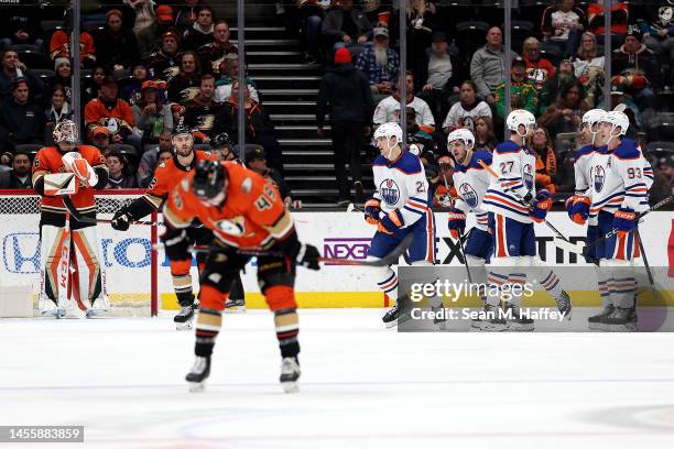 Ryan Nugent-Hopkins, Brett Kulak, and Cody Ceci of the Edmonton Oilers congratulate Klim Kostin of the Edmonton Oilers after his goal while John...