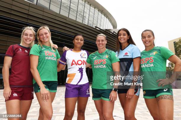 Sophie Duff of Queensland 7's, Faitala Moleka of the University Women's 7s Rising Stars and Milla Elaro of NSW 7's pose alongside Australian 7's...