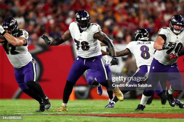 Morgan Moses of the Baltimore Ravens blocks during an NFL football game against the Tampa Bay Buccaneers at Raymond James Stadium on October 27, 2022...