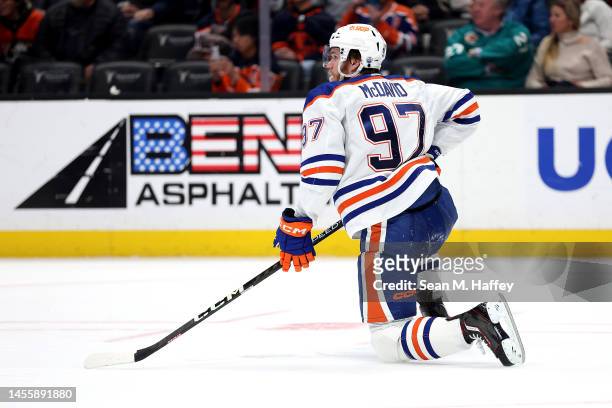 Connor McDavid of the Edmonton Oilers gets up from the ice after falling during the third period of a game against the Anaheim Ducks at Honda Center...