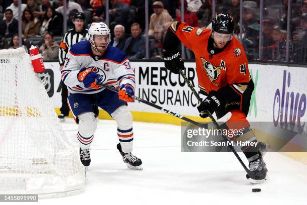 Connor McDavid of the Edmonton Oilers poke checks Cam Fowler of the Anaheim Ducks during the third period of a game at Honda Center on January 11,...