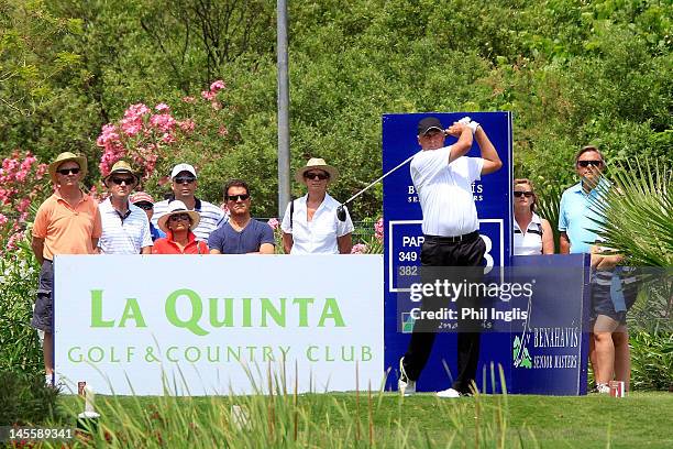 Former England football manager Fabio Capello watches current leader Mike Harwood of Australia during the second round of the Benahavis Senior...