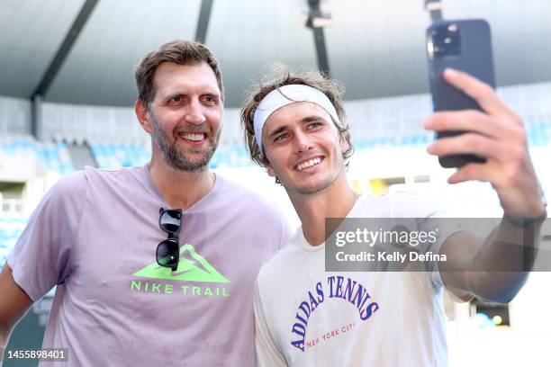 Dirk Nowitzki and Alexander Zverev pose during media opportunity ahead of the 2023 Australian Open at Melbourne Park on January 12, 2023 in...