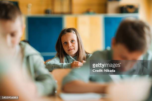 schoolgirl studying in classroom